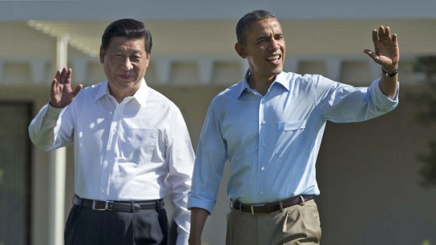 President Barack Obama and Chinese President Xi Jinping, left, walk at the Annenberg Retreat of the Sunnylands estate in Rancho Mirage, California.