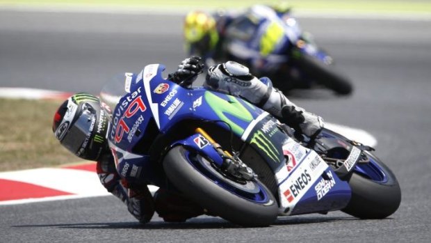 Jorge Lorenzo (front) and Valentino Rossi  duel it out during the Catalunya Motorcycle GP in Spain on June 14.