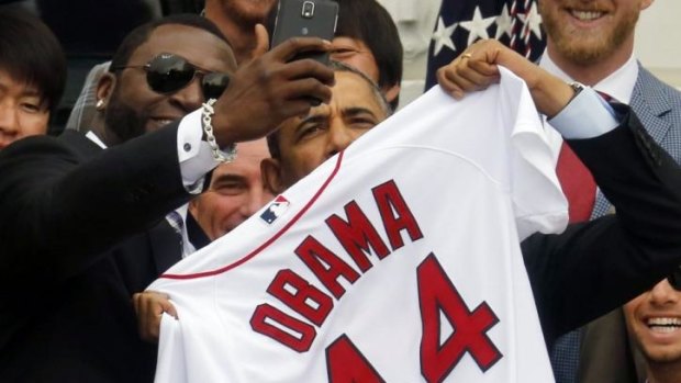 US President Barack Obama poses with baseball star David Ortiz for a "selfie".