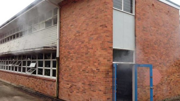 Smoke billows from a storeroom at Mitchelton State School.