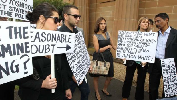 Protests: Rachelle Louise leads her boyfriend's supporters outside court.