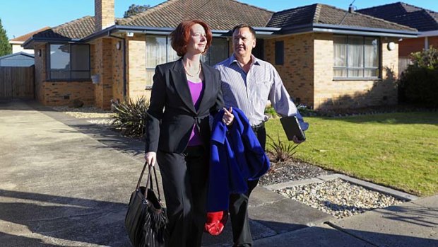 Julia Gillard with partner Tim Mathieson leave their Altona home.