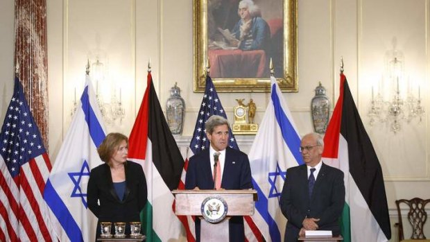 US Secretary of State John Kerry with Israel's Justice Minister Tzipi Livni, left, and chief Palestinian negotiator Saeb Erekat, right.