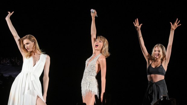 CHICAGO, IL - JULY 19:  Taylor Swift performs with Andreja Pejic and Lily Donaldson during The 1989 Tour at Soldier Field on July 19, 2015 in Chicago, Illinois.  (Photo by Daniel Boczarski/LP5/Getty Images for TAS)