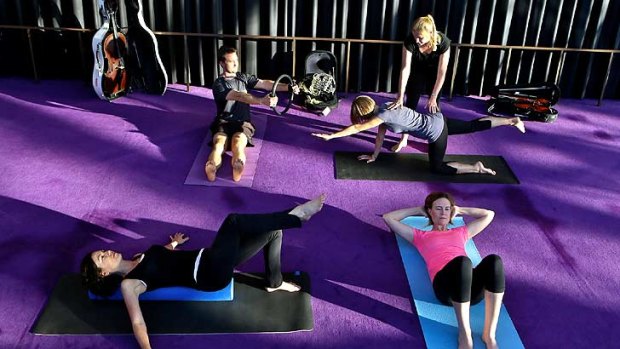 Health and wellbeing training: Instructor Jane Leathwood conducts a pilates class with SSO musicians David Campbell, Rosemary Curtin, Rachel Silver and Elizabeth Neville.