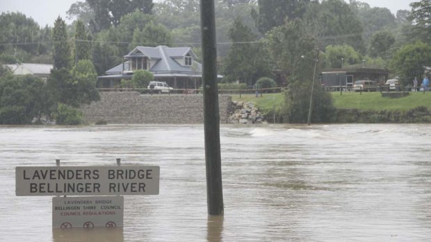 Going .. Bellingen is again cut in two with floodwaters covering Lavender's Bridge at noon today.