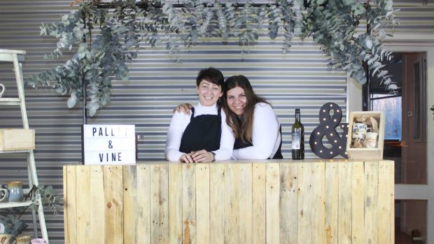 Looking all cosy for winter, Anita Kirkowa and Gabrielle Petrevski of Pallet and Vine with their rustic bar made from the materials from boyandgirlco.