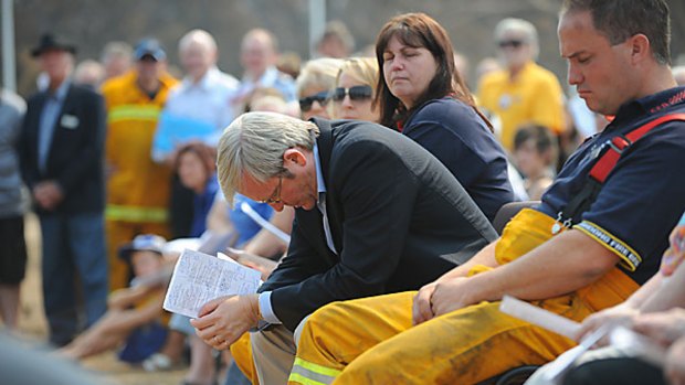 Overcome with emotion... Prime Minister Kevin Rudd during an open-air church service for the victims of the Victorian bushfires in Wandong.