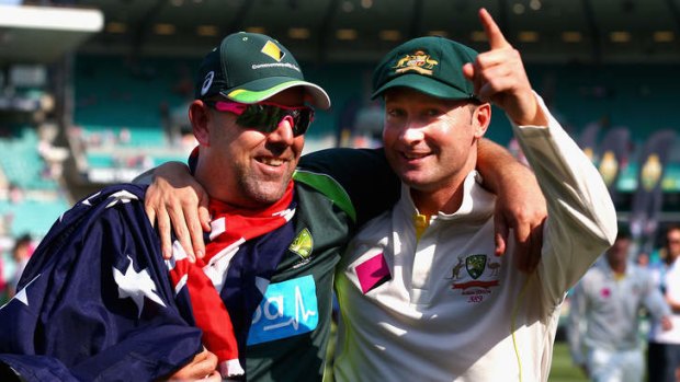 Darren Lehmann and Michael Clarke celebrate victory during day three of the fifth Ashes Test against England at the Sydney Cricket Ground.
