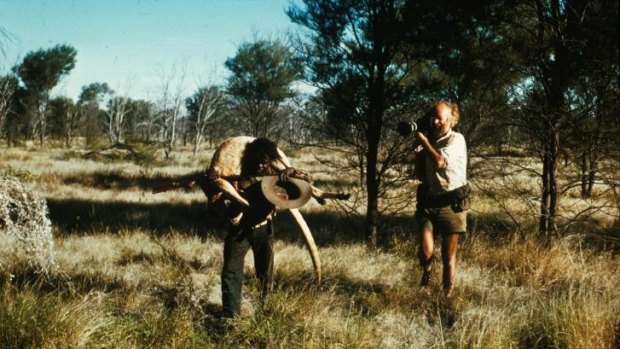  Ian Dunlop filming Shorty Bruno (carrying kangaroo) near Yayayi in the Northern Territory in 1974.  