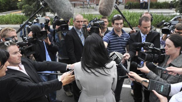 The teenager attracts media attention outside an AFLPA hearing into Nixon's conduct.