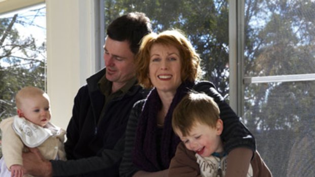 John Domeney and his wife, Julia Langham, with their children Amelia, 4 months, and Max, 3.