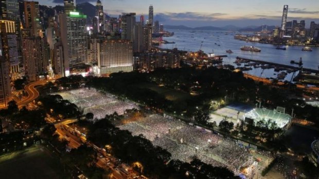Organisers say that up to 180,000 people attended the ceremony in Hong Kong.