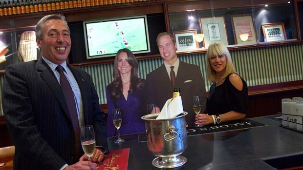 Hotel Windsor manager David Perry and guest Melissa Evans found that the royal couple - or a cut-out of them, at least - seemed very relaxed at the Cricketer's Bar yesterday.