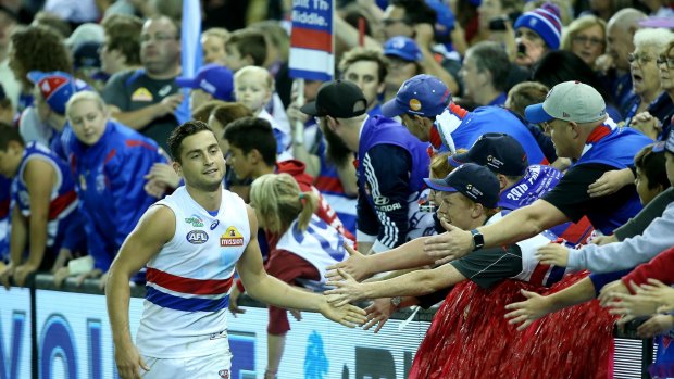 Bulldogs faithful: Luke Dahlhaus celebrates with fans after the match.