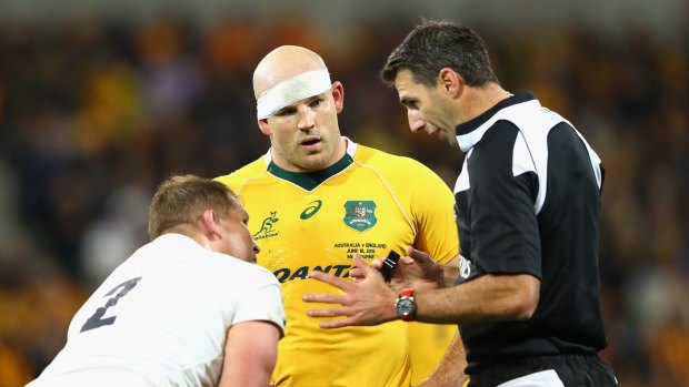 Time for a chat: Referee Craig Joubert talks to Wallabies captain Stephen Moore and England rival Dylan Hartley.