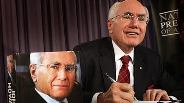 John Howard signs copies of his memoir.