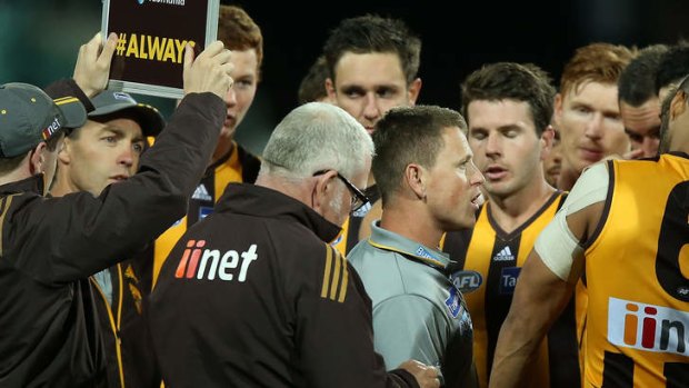 Assitant coach Brendon Bolton takes the lead for the night as Alastair Clarkson (left) looks on.