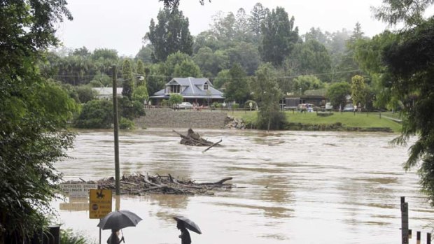 Town split in two &#8230; the Bellinger River at Lavenders Bridge, Bellingen, has burst its banks. Emergency services are on standby with more rain forecast overnight.