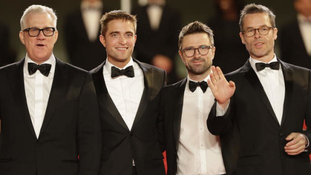 Producer David Linde, Robert Pattinson, director David Michod, and Guy Pearce arrive for the screening of <i>The Rover</i> in Cannes on May 18, 2014.
