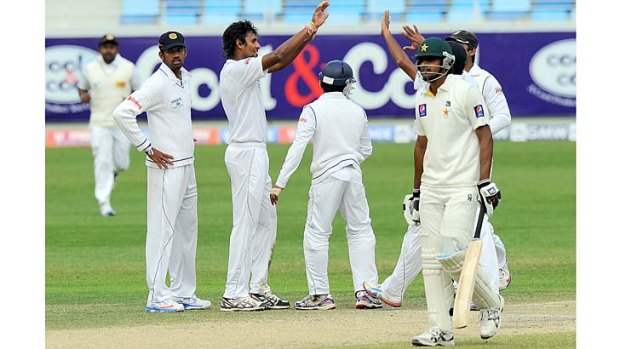 Sri Lanka's Suranga Lakmal (centre) celebrates with teammates after dismissing Pakistan's Rahat Ali (right) on the final day of the second Test in Dubai on Sunday.