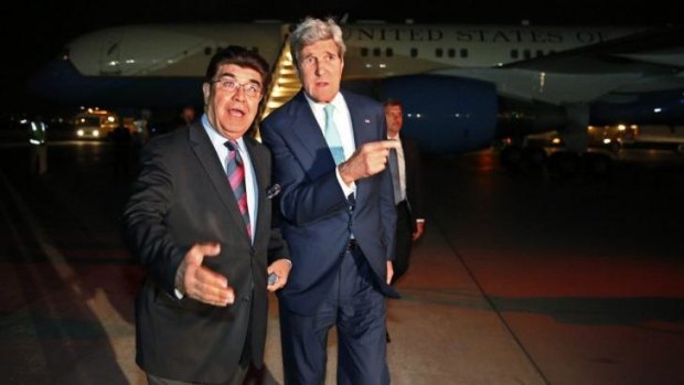 This way?: US Secretary of State John Kerry (right) with the Afghan foreign ministry's chief of protocol, Hamid Siddiq, at Kabul airport on Friday.