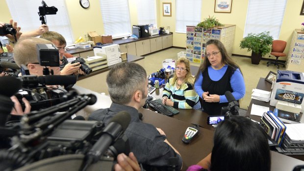 Rowan County Clerk Kim Davis, right, talks with David Moore following her office's refusal to issue marriage licences at the Rowan County Courthouse in Morehead, Kentucky, on Tuesday.