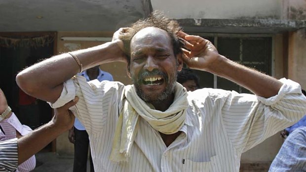Distraught ... a man mourns the death of a relative killed in one of Thursday's explosions in Hyderabad.