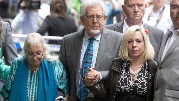 Rolf Harris leaves court with wife Alwen and daughter Bindi.