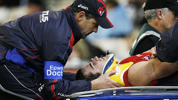 Daniel Bell after being knocked out in a Melbourne v Collingwood game in 2007.