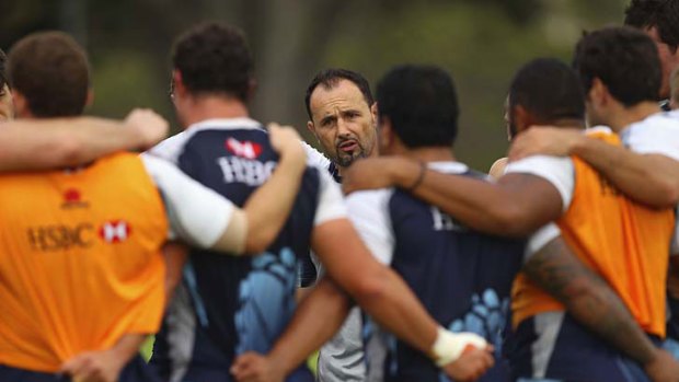 Content in his work ... assistant coach Michael Foley addresses the Waratahs troops at training. He is popular with the players.
