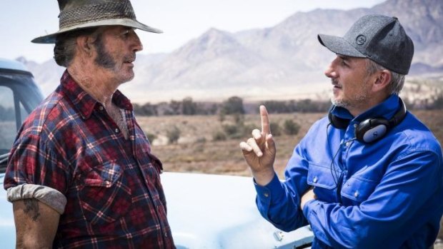 Getting gory again: Director Greg McLean (right) on the set of <i>Wolf Creek 2</i> with John Jarratt.