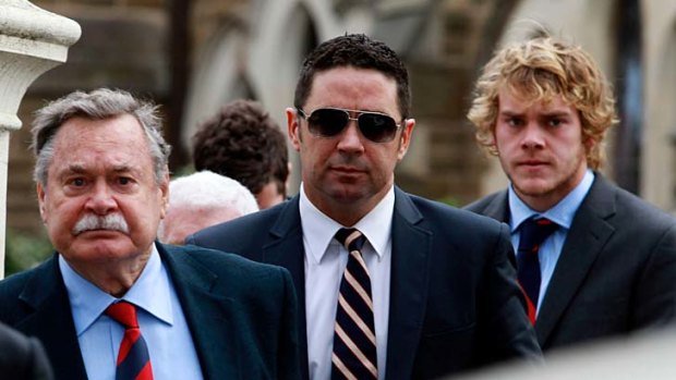 At the funeral of ground-breaking Demon Sean Wight, in 2011, with Demons legend Ron Barassi and number one draft pick Jack Watts.