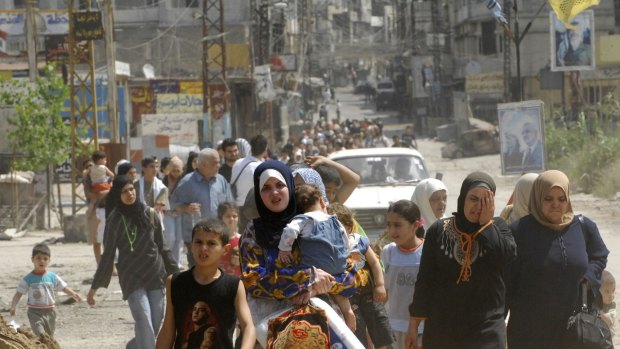 Palestinian residents flee the Nahr al-Bared camp in May 2007.