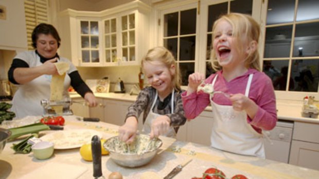 Play's the thing ... learning to make ravioli gives Ruby and Holly Lewis plenty to laugh about.