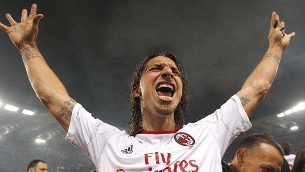 Zlatan Ibrahimovic celebrates after winning the Serie A title with AC Milan.