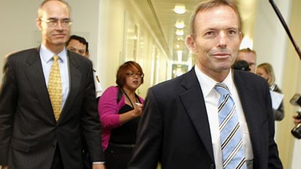 Tony Abbott heads back to his office after defeating Malcolm Turnbull by one vote.