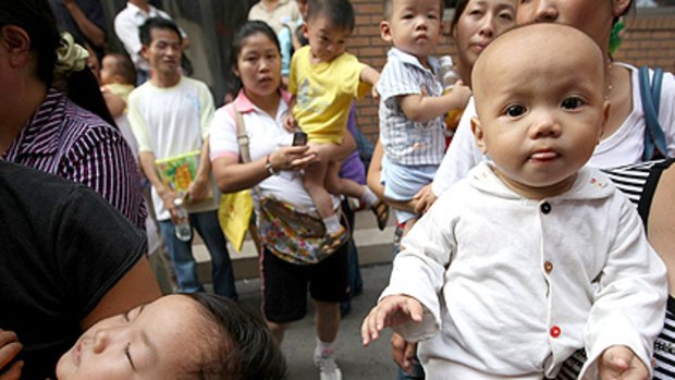 Tainted formula: Anxious parents wait for doctors to examine their infants at a hospital in Hangzhou, in eastern China, as the milk contamination scandal grows.