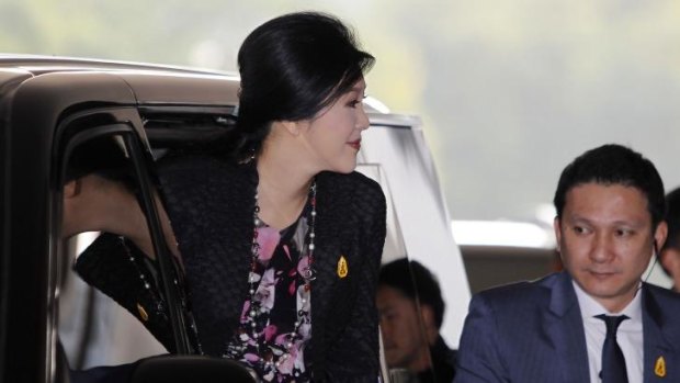 Thailand's Prime Minister Yingluck Shinawatra arrives at the Royal Thai Air Force headquarters before a cabinet meeting in Bangkok.