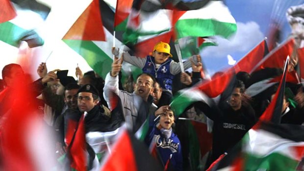 Celebrating ... Palestinians after the UN vote.