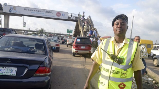An officer of the Lagos State Traffic Management Authority (LASTMA) wears a vest to advertise horn-free day in Lagos, which takes place on Thursday.