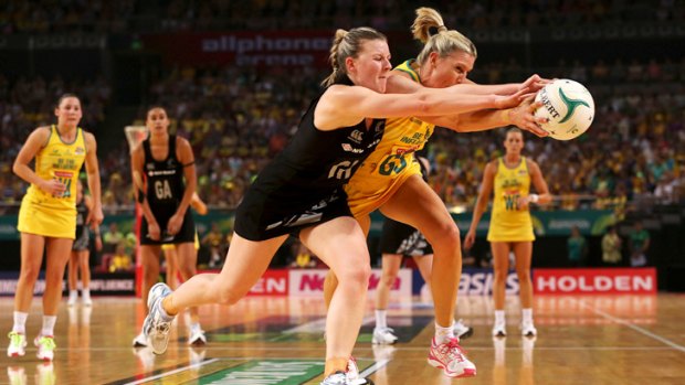 Australia's Catherine Cox and New Zealand's Katrina Grant compete for the ball.