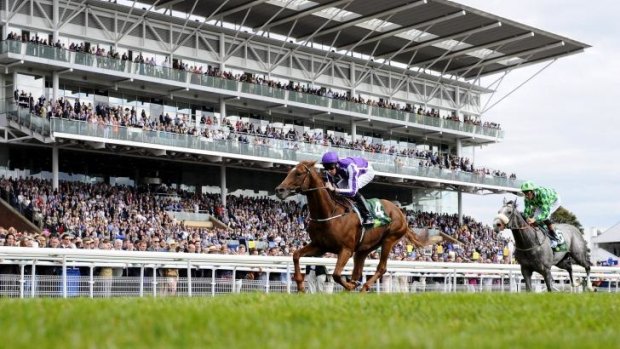 All in the family: Joseph O'Brien rides Australia to victory in the Juddmonte International at York on Wednesday.