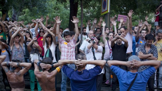 Protestors perform in Madrid.