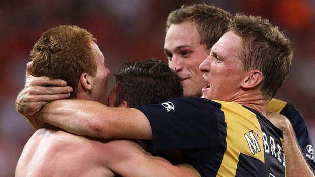 Oliver Bozanic (L) of the Mariners celebrates with team mates after scoring his side's second goal.