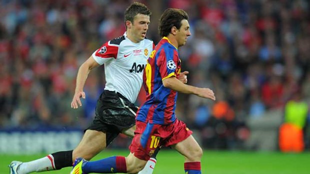 Barcelona's Lionel Messi has possession of the ball ahead of Manchester United's Michael Carrick in the Champions League final at Wembley Stadium.