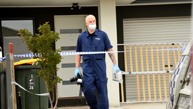 Forensic police inspected the crime scene on Friday.