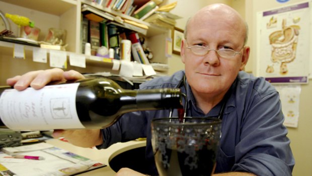 Philip Norrie pours a glass of resveratrol-enhanced wine.