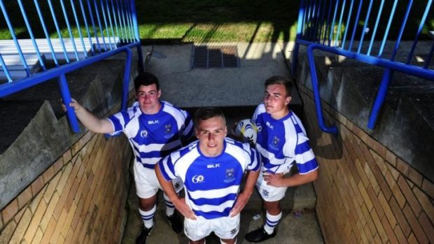 St Edmunds rugby players L-R Thomas Carvolth, 17, Jordan Jackson-Hope, 18, and Ben Darmody, 17, wearing the school's 60th anniversary jersey which they will wear as the only Australian school in a Japanese tournament.