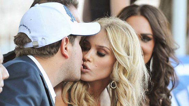 James Stunt kisses his fiancee Petra Ecclestone during the AmberLounge Fashion Monaco 2011.